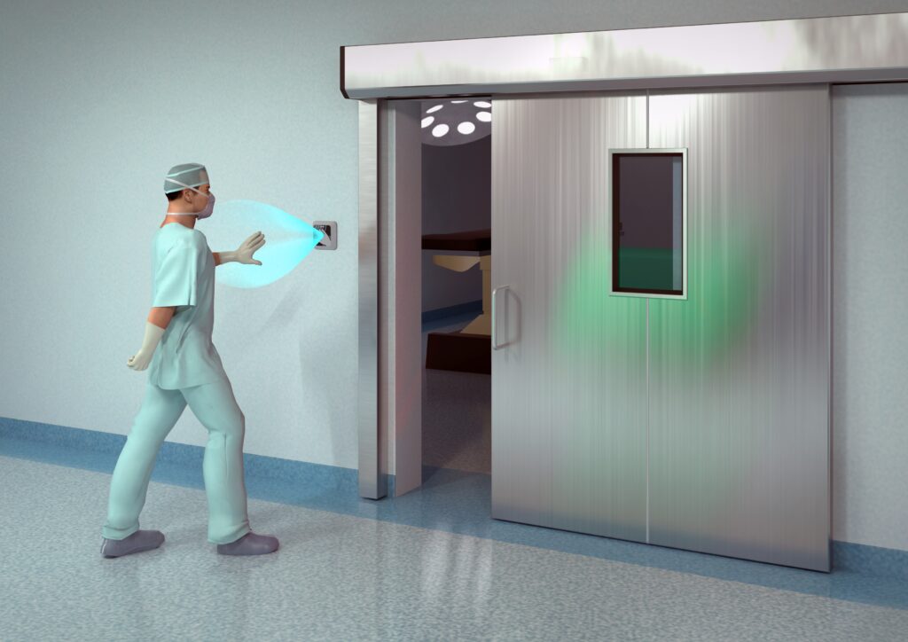 Hospital staff using the Hotron ClearWave hygienic, touchless, automatic door activation switch.