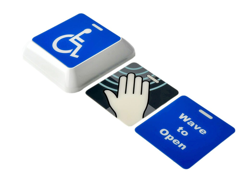 Three faceplates provided (wheelchair logo, hand graphic, and "Wave to Open") with the Hotron ClearWave hygienic, touchless, automatic door activation switch.